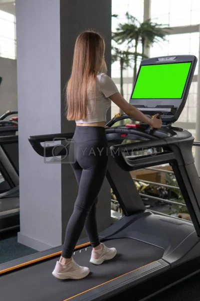 Girl on the treadmill — Fitness room