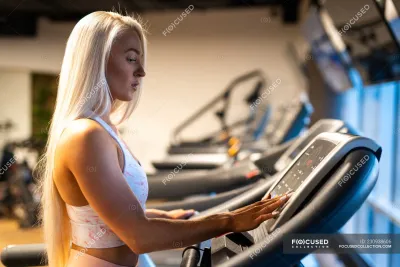 Girl in the gym — On the treadmill
