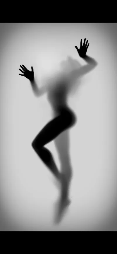 Silhouette of a girl behind glass — Silhouette of a female figure