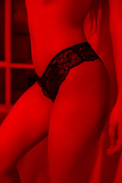 Girl in red erotic lingerie — Sexy and candid