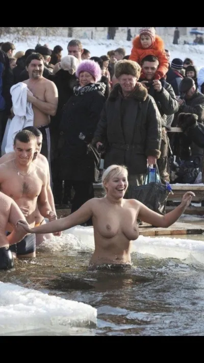Naked women bathe in an ice hole for baptism — Baptism bathing