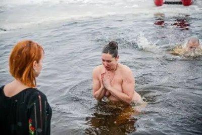 Swimming in an ice hole for baptism — Reservoir bath