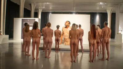 An exhibition of naked women — A girl undressed in museum